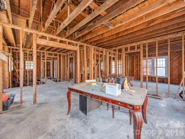 a table and chairs in front of a building