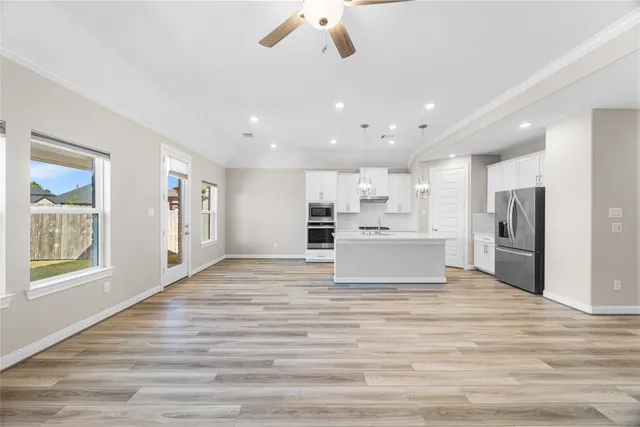 a view of kitchen with wooden floor and window