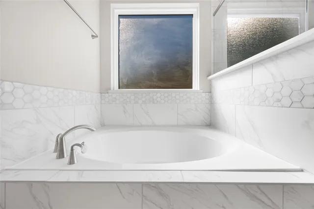 a close view of a bathtub in bathroom