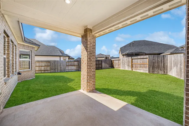 a view of a house with a back yard