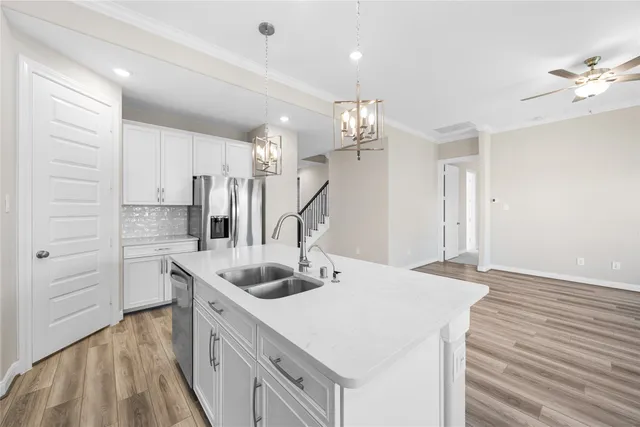 a kitchen that has a lot of cabinets in it