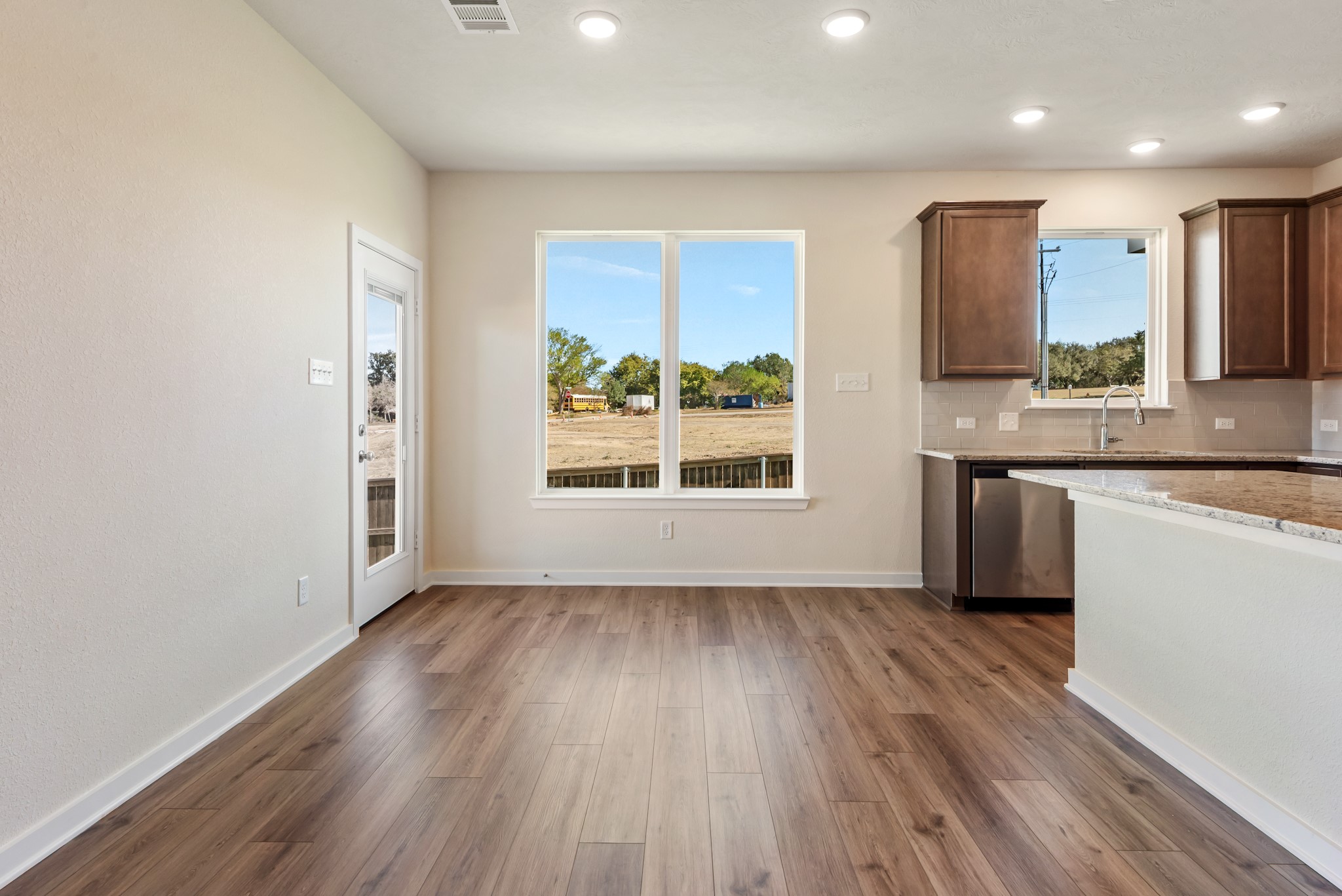 1456 Lk Rdg Drive Brenham, TX 77833 - Photo 15 of 34 an empty room with wooden floor and a window