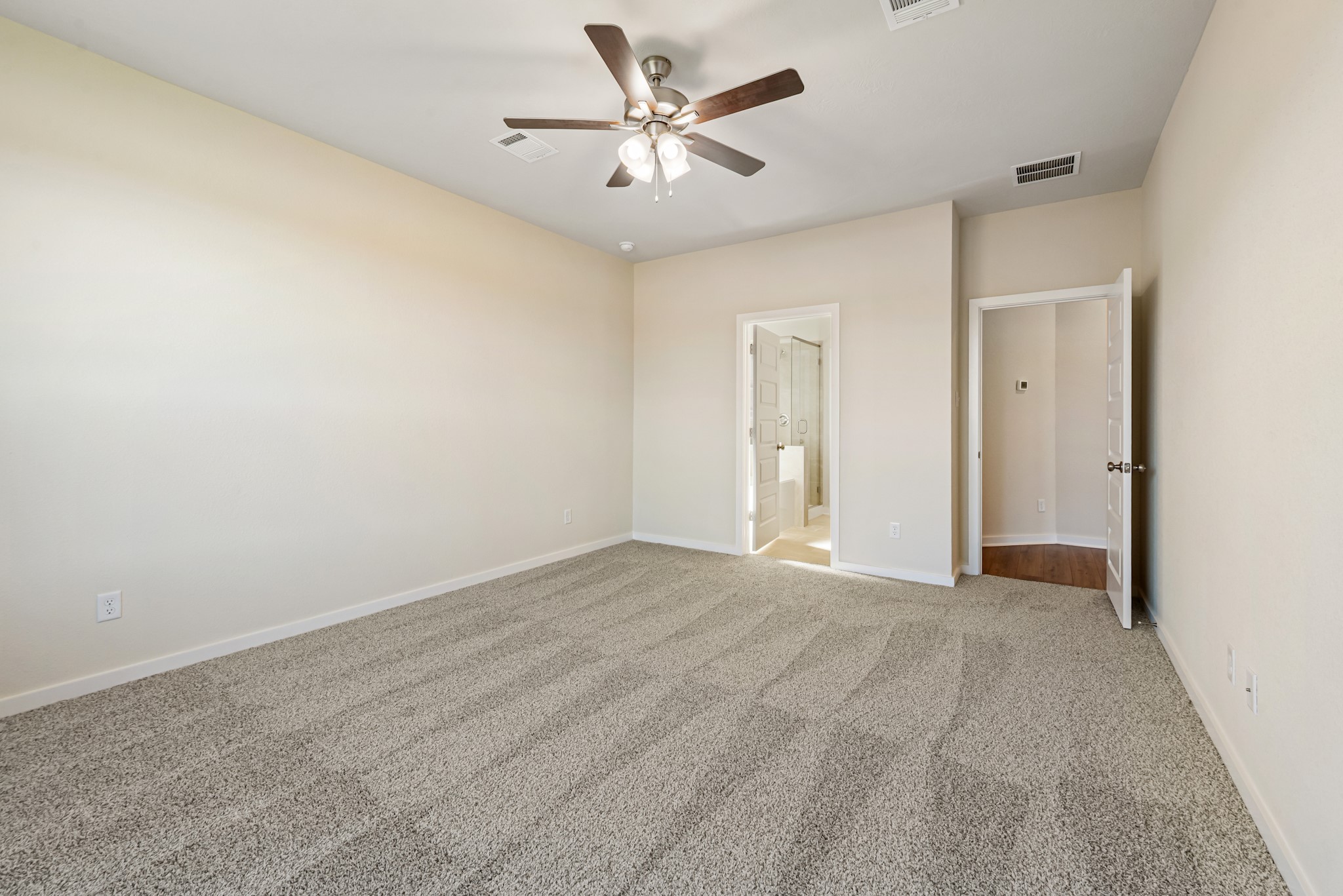1456 Lk Rdg Drive Brenham, TX 77833 - Photo 24 of 34 an empty room with closet and a ceiling fan