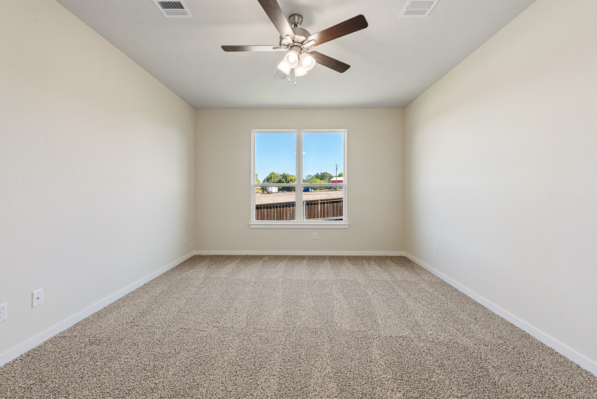 1456 Lk Rdg Drive Brenham, TX 77833 - Photo 25 of 34 an empty room with a window and a ceiling fan