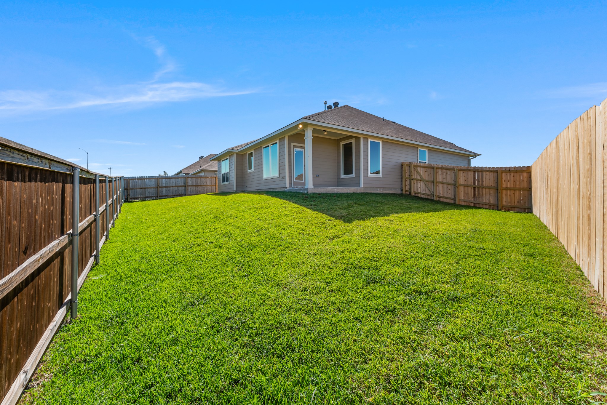1456 Lk Rdg Drive Brenham, TX 77833 - Photo 34 of 34 a yellow house with a yard