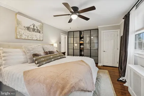 a spacious bedroom with a bed and a large mirror