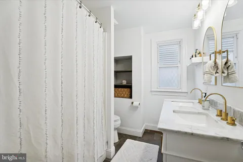 a bathroom with a sink and a large mirror