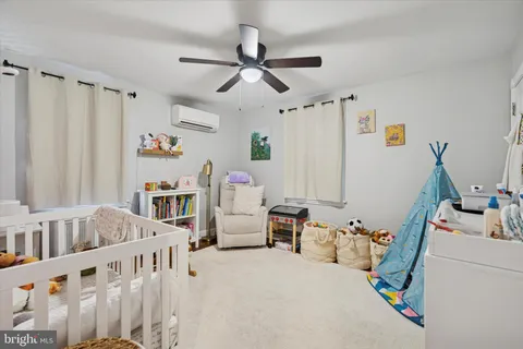 a bedroom with furniture and white walls