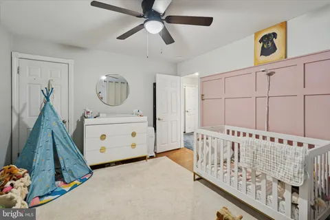 a view of a bedroom with furniture