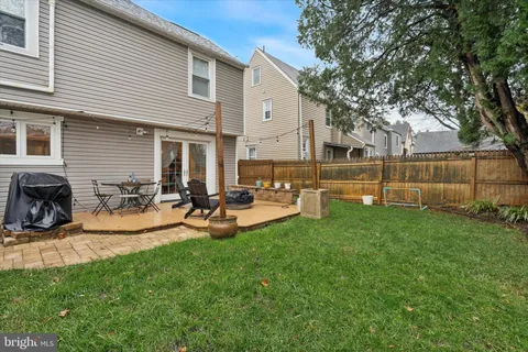 a view of a house with backyard porch and sitting area