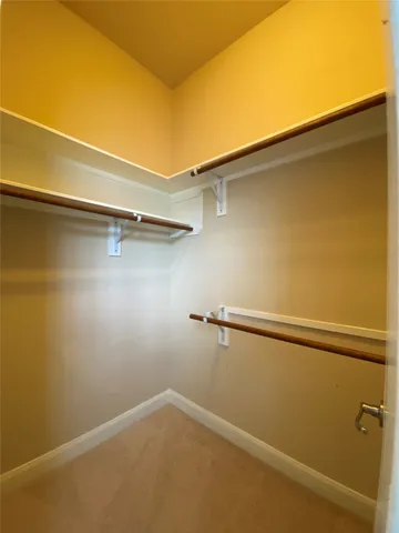 a bedroom with bed and a window