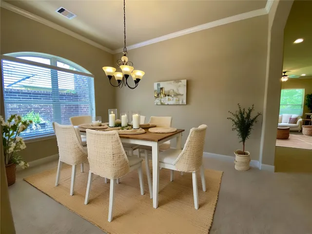 a large kitchen with kitchen island granite countertop a large counter top and stainless steel appliances