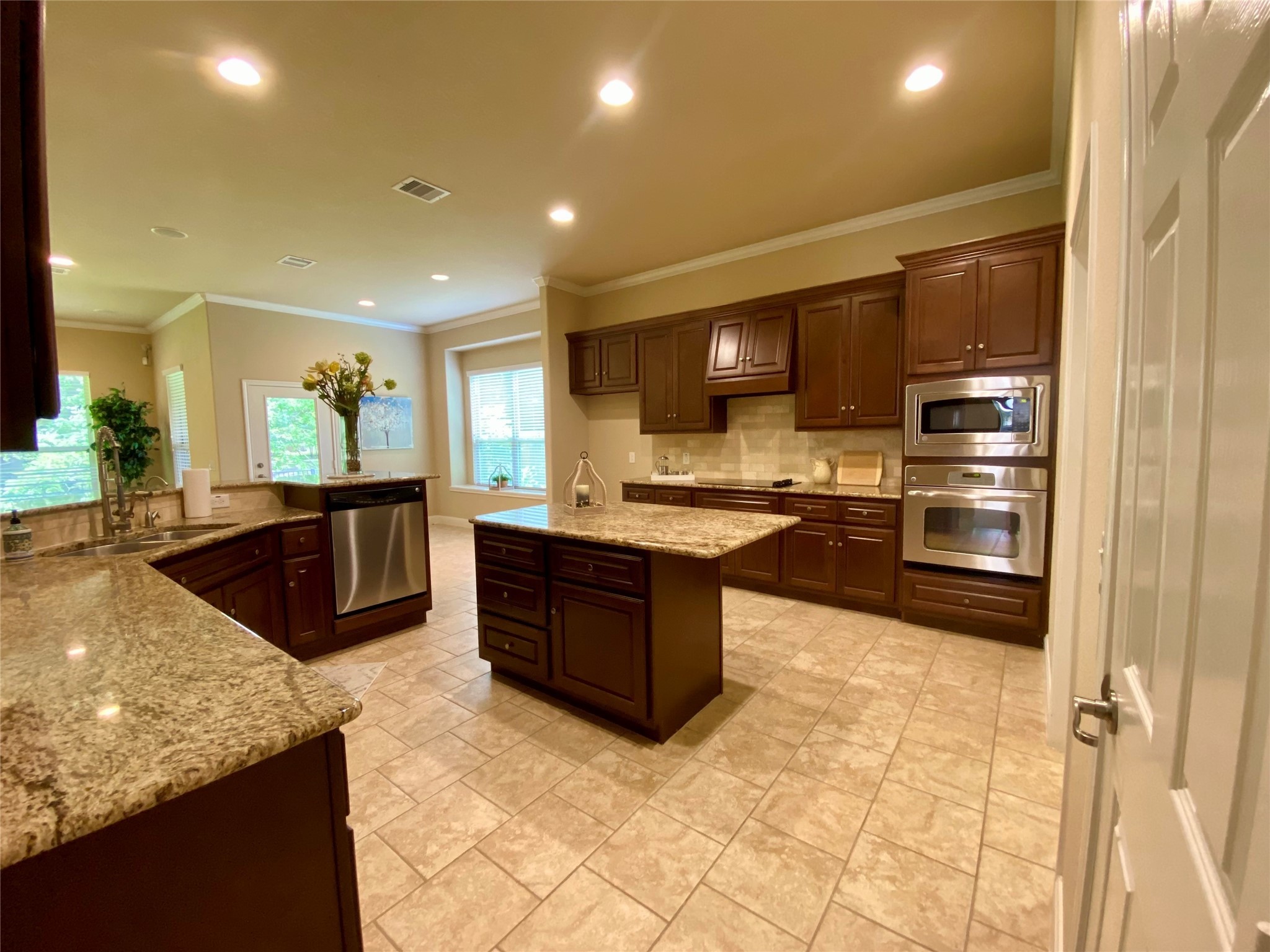 19861 Driver Forest Drive Porter, TX 77365 - Photo 15 of 38 a large kitchen with kitchen island granite countertop a large counter top and stainless steel appliances