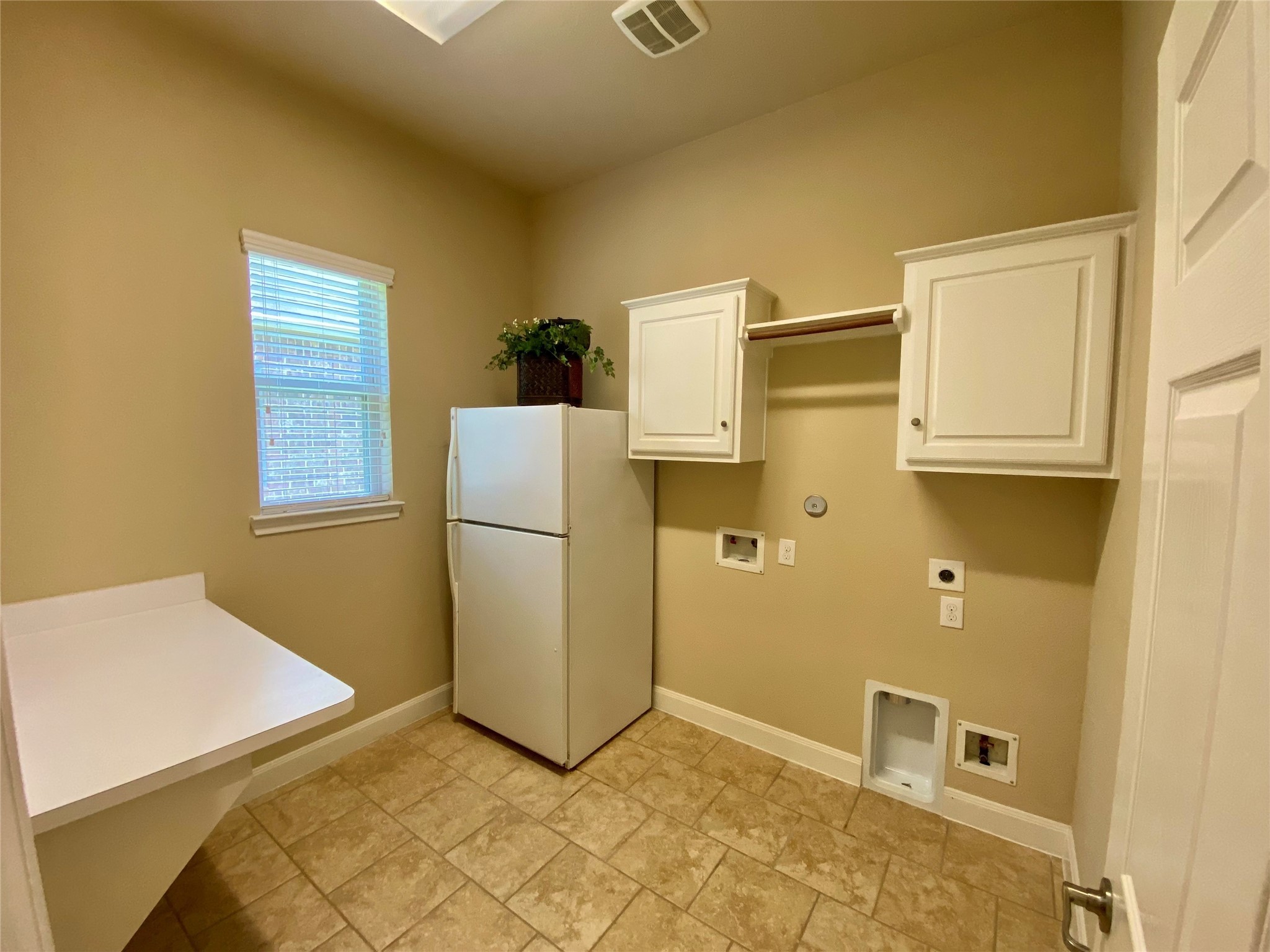 19861 Driver Forest Drive Porter, TX 77365 - Photo 16 of 38 a view of a storage & utility room with a refrigerator