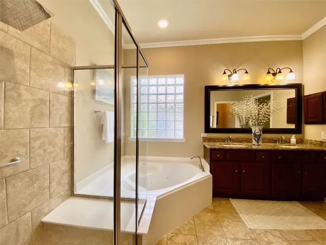 a white toilet sitting next to a bathroom and a shower