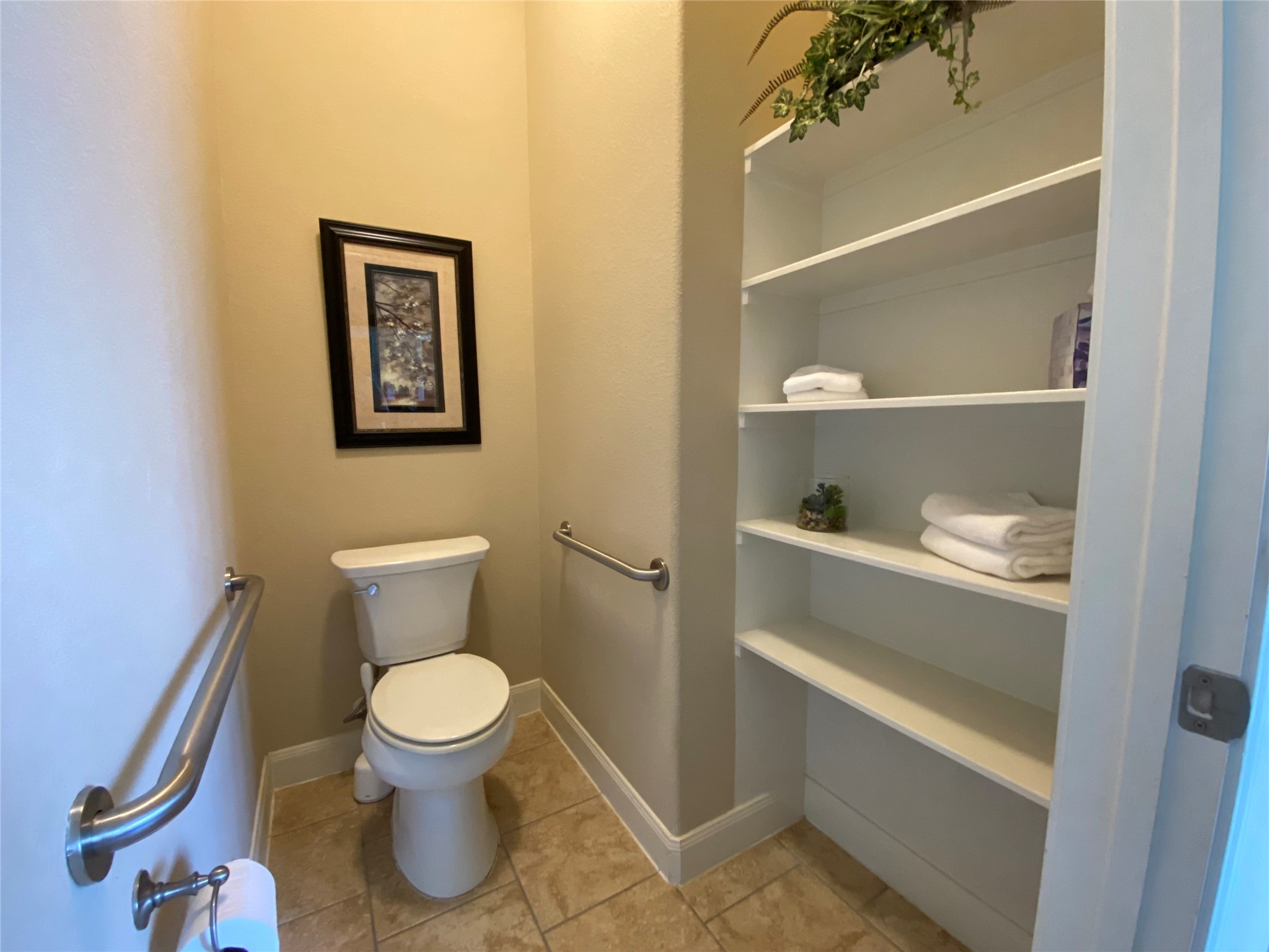 19861 Driver Forest Drive Porter, TX 77365 - Photo 23 of 38 a white toilet sitting next to a bathroom and a shower