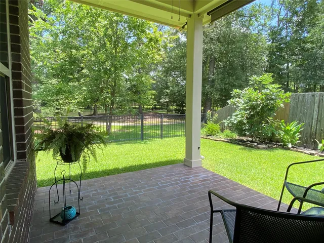 a patio view with a table and chairs