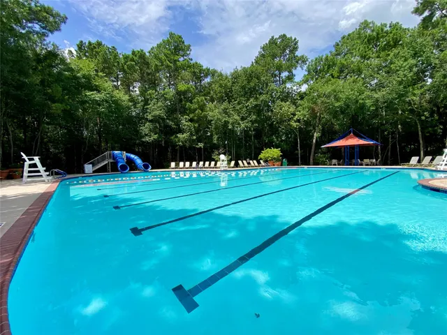 a view of a swimming pool with a patio