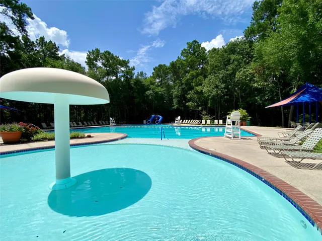 a view of a patio with couches chairs and a big yard
