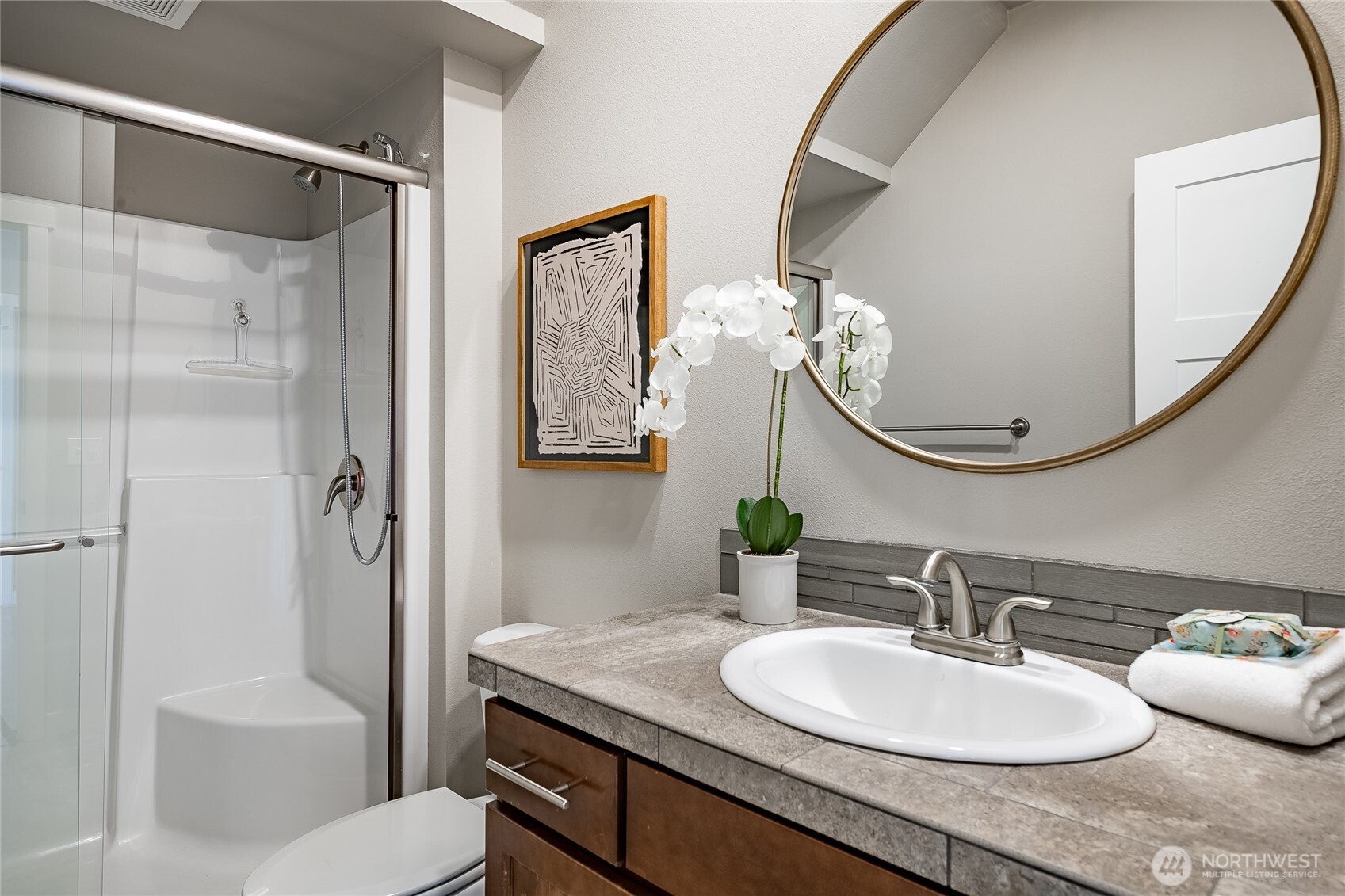 5319 Coastal Loop Blaine, WA 98230 - Photo 19 of 40 a bathroom with a granite countertop sink mirror toilet and bathtub