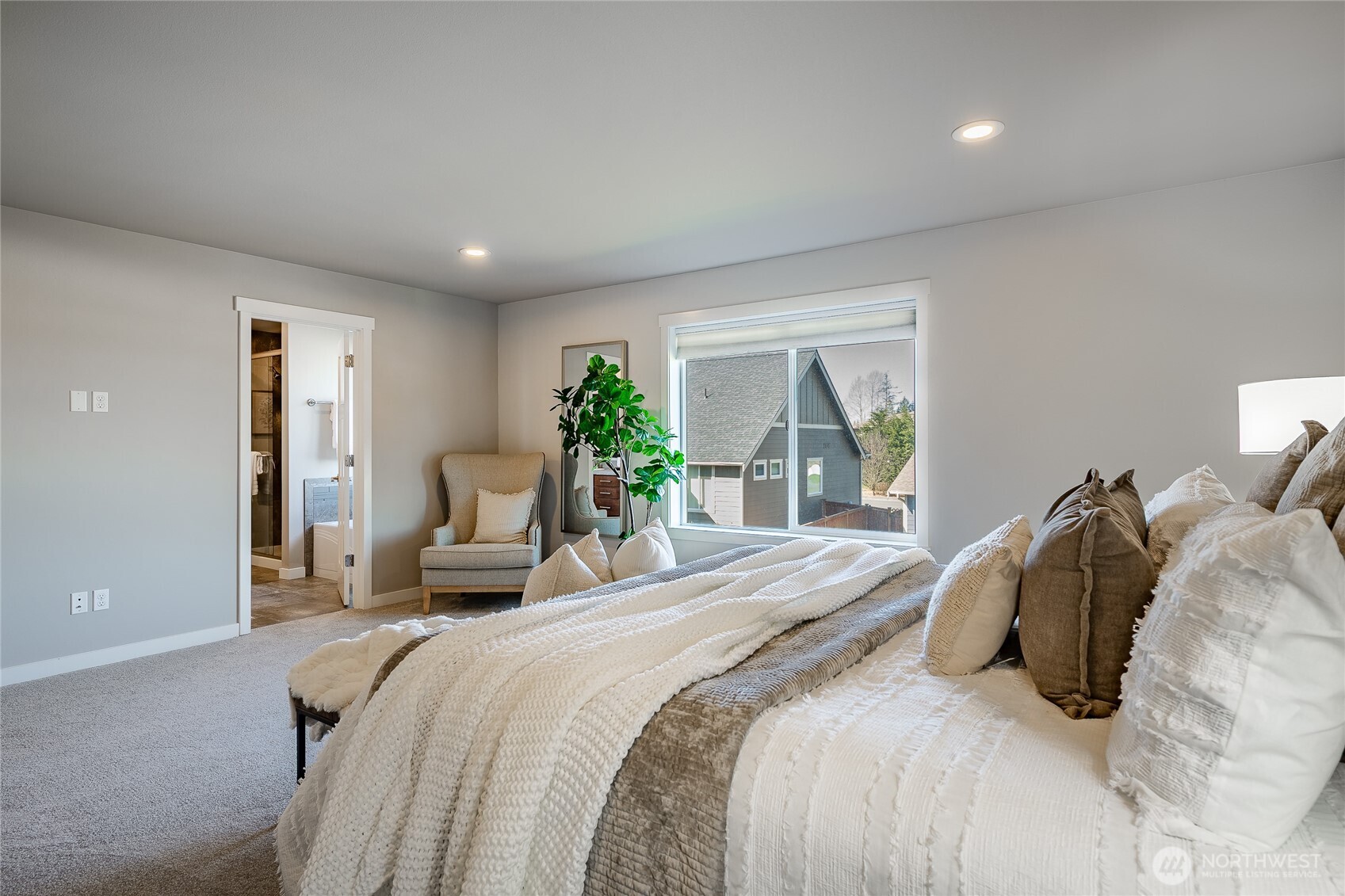 5319 Coastal Loop Blaine, WA 98230 - Photo 23 of 40 a bedroom with a large bed and a large window