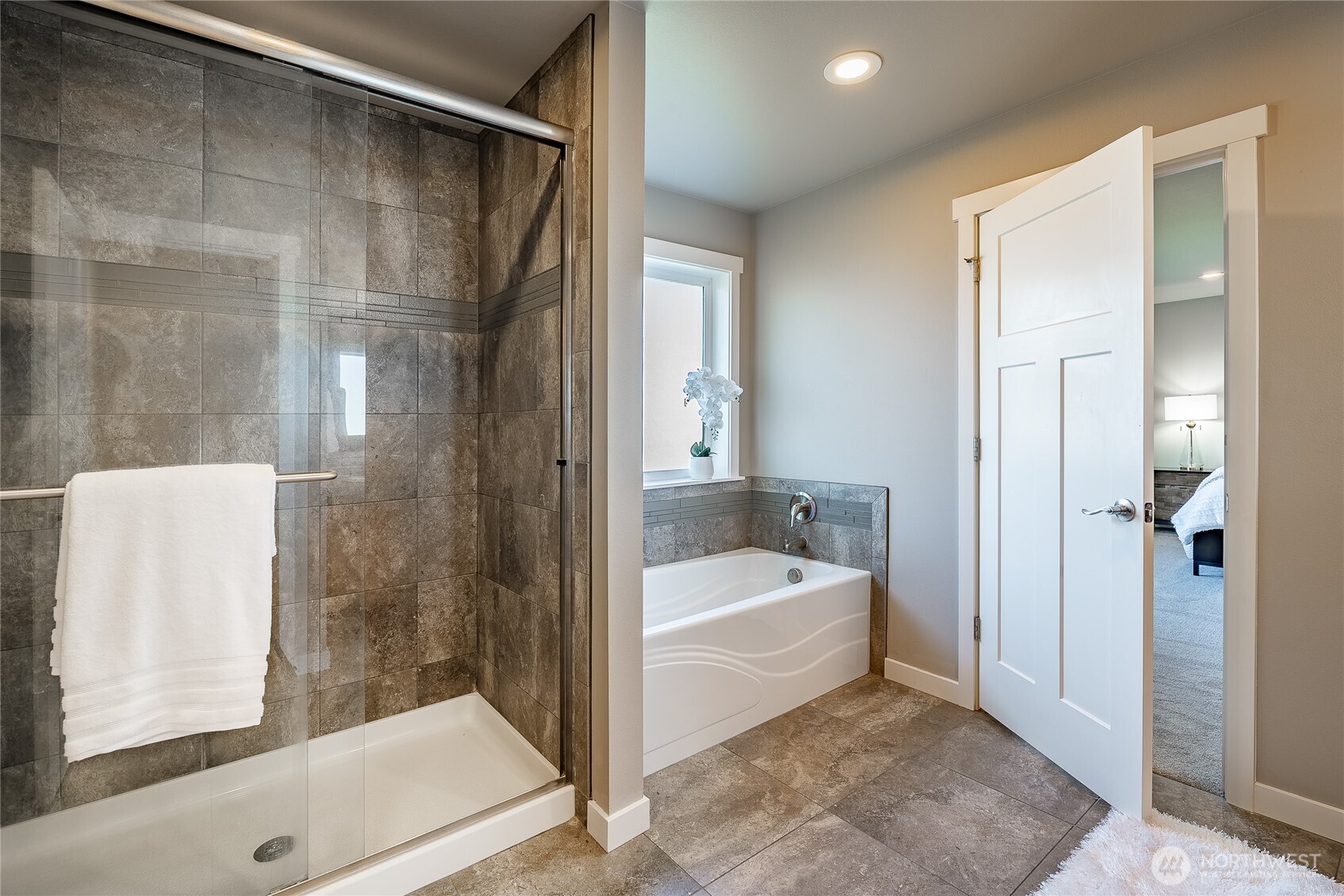 5319 Coastal Loop Blaine, WA 98230 - Photo 25 of 40 a bathroom with a tub shower and mirror