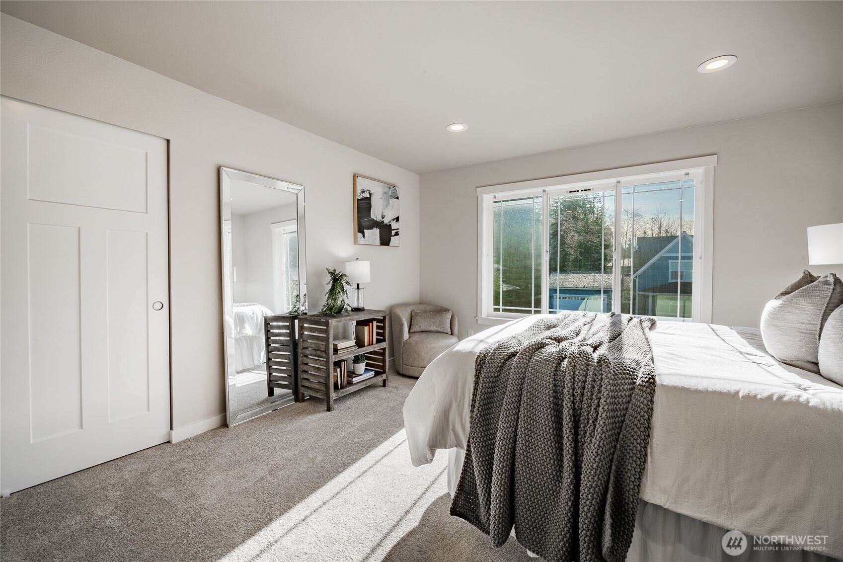 5319 Coastal Loop Blaine, WA 98230 - Photo 27 of 40 a bedroom with a bed and a large window