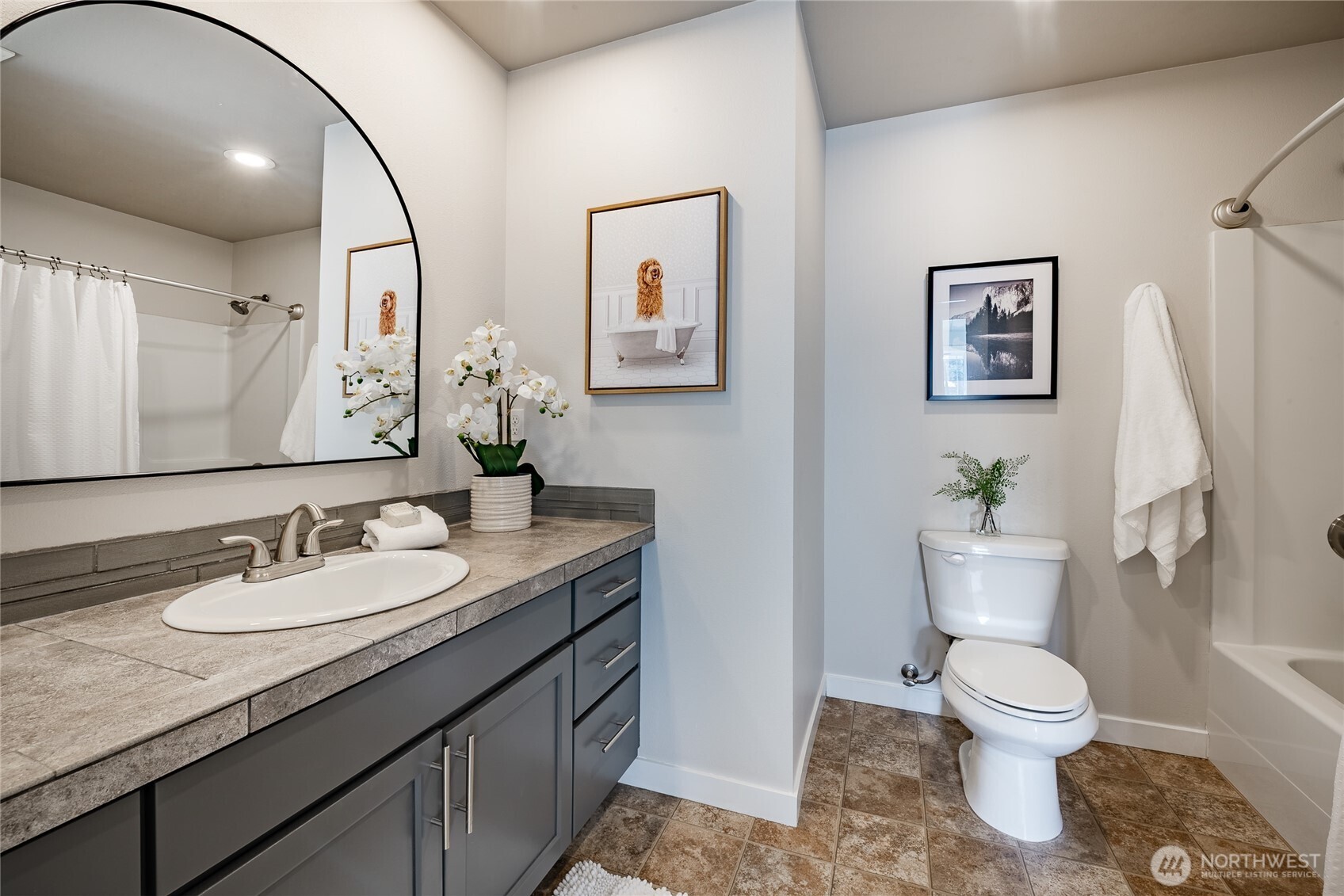 5319 Coastal Loop Blaine, WA 98230 - Photo 28 of 40 a bathroom with a toilet sink and mirror