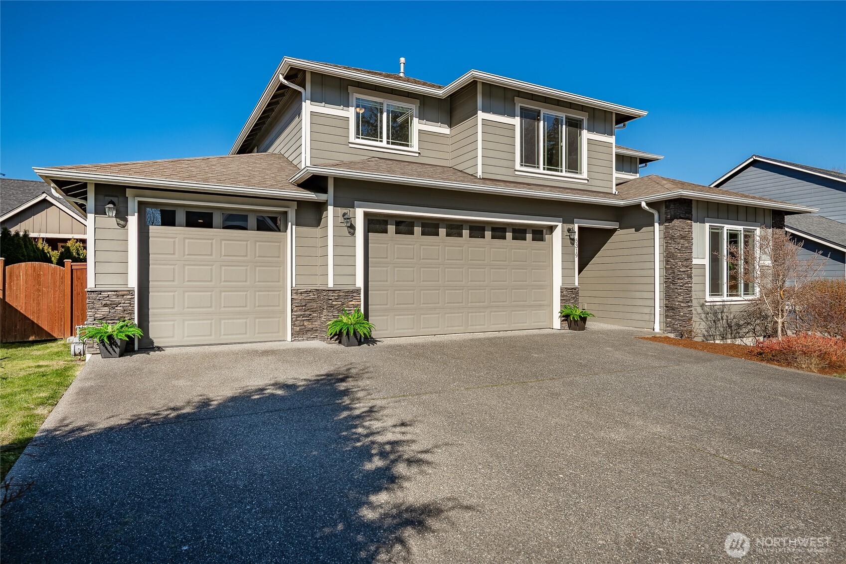 5319 Coastal Loop Blaine, WA 98230 - Photo 40 of 40 a front view of a house with a yard and garage