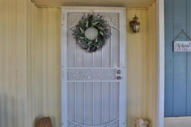a view of a hallway with a dining room