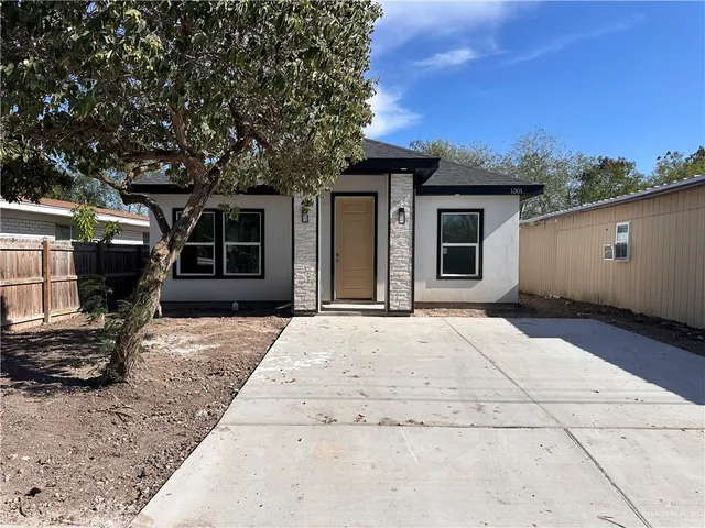 a house with trees in the background