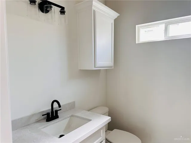 a bathroom with a sink and a toilet