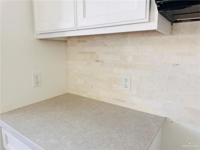 a view of a refrigerator in kitchen