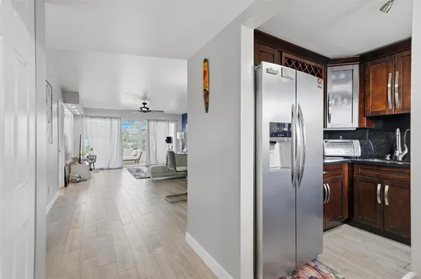 a kitchen with stainless steel appliances a refrigerator and a sink
