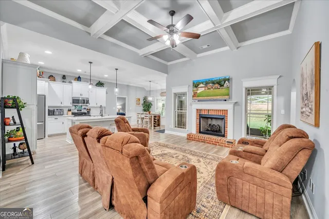 a living room with furniture fireplace and a flat screen tv