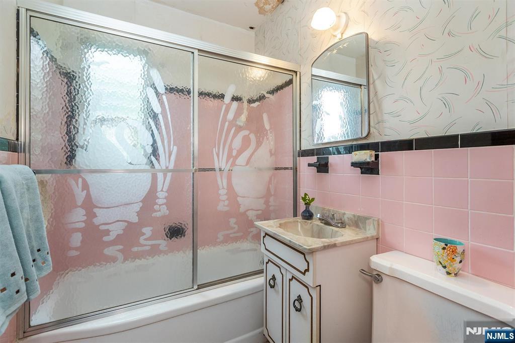 66 Coeyman Avenue Bloomfield, NJ 07003 - Photo 14 of 29 a bathroom with a sink and a mirror