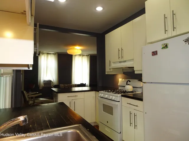 a kitchen that has a cabinets and a stove