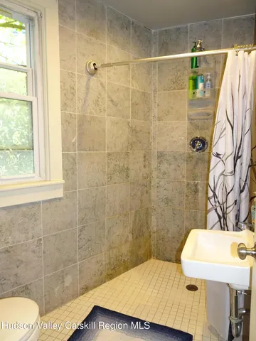 a bathroom with a sink and a shower