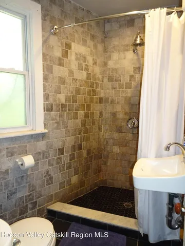 a view of a hardwood floor and staircase