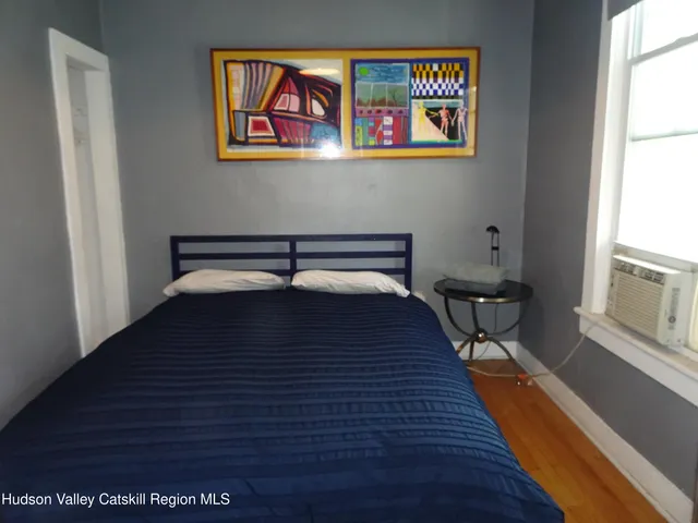 a room with furniture and wooden floor