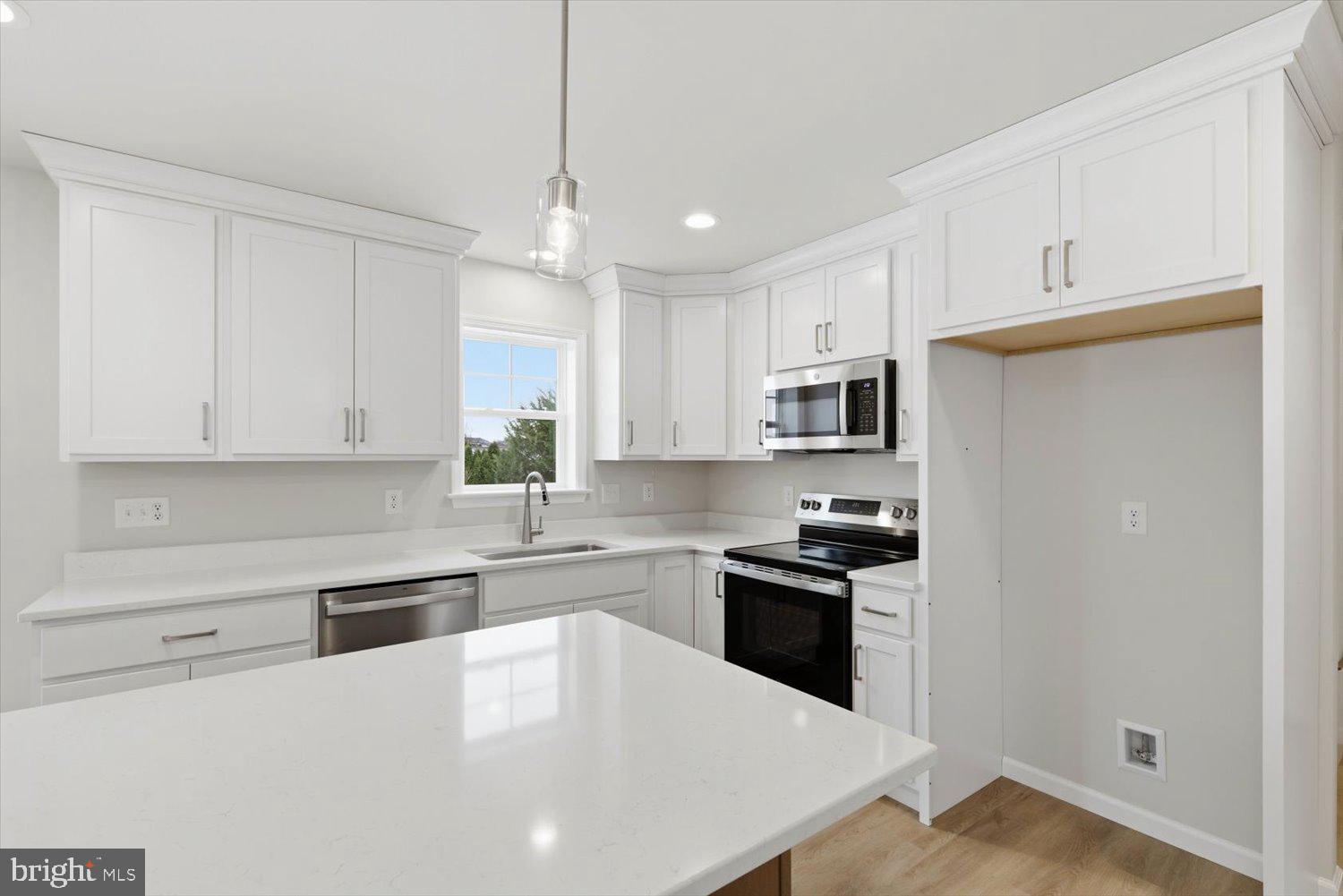 228 Hockersville Road Hershey, PA 17033 - Photo 11 of 36 a kitchen with stainless steel appliances granite countertop a sink stove and refrigerator