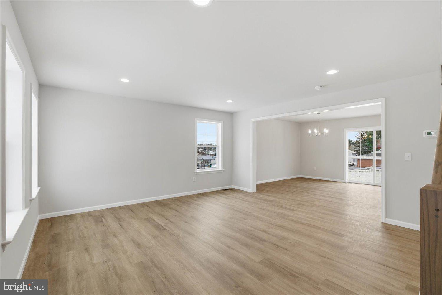 228 Hockersville Road Hershey, PA 17033 - Photo 3 of 36 a view of an empty room with wooden floor and a window