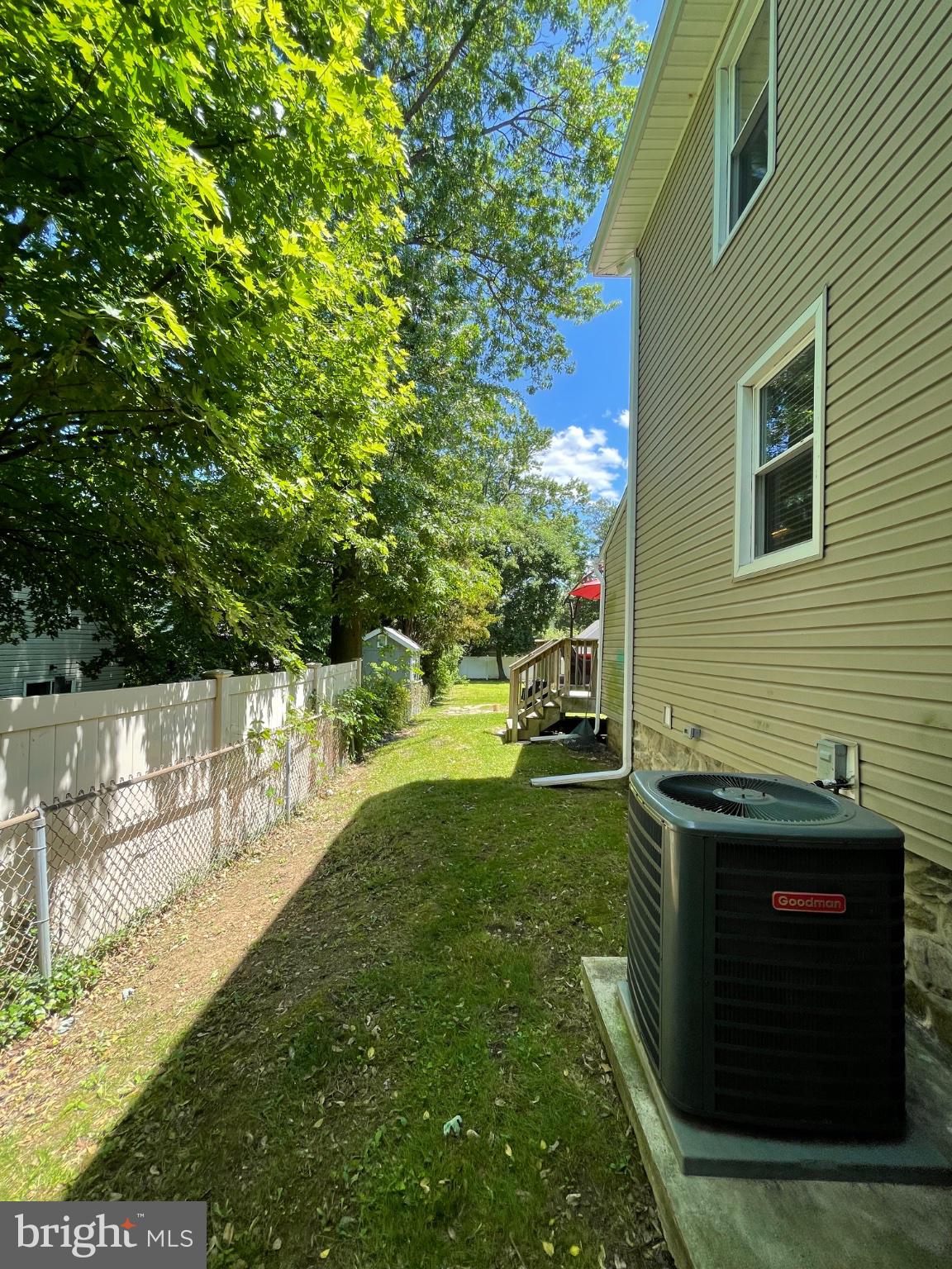 8129 Pine Road Philadelphia, PA 19111 - Photo 37 of 40 Sunny side yard with lush greenery.