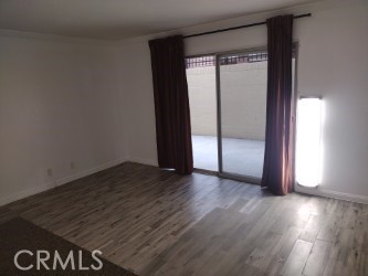 1040 Cedar Avenue, Unit 2 Long Beach, CA 90813 - Photo 3 of 6 an empty room with wooden floor and windows