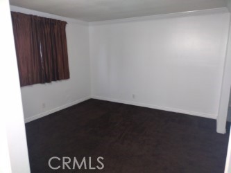 1040 Cedar Avenue, Unit 2 Long Beach, CA 90813 - Photo 4 of 6 an empty room with a wooden door