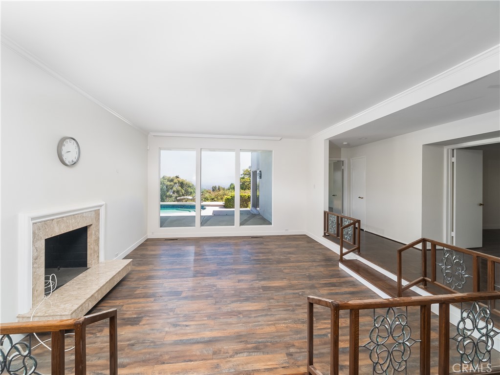 20193 Adele Drive Woodland Hills, CA 91364 - Photo 13 of 38 a view of an empty room with wooden floor and a window