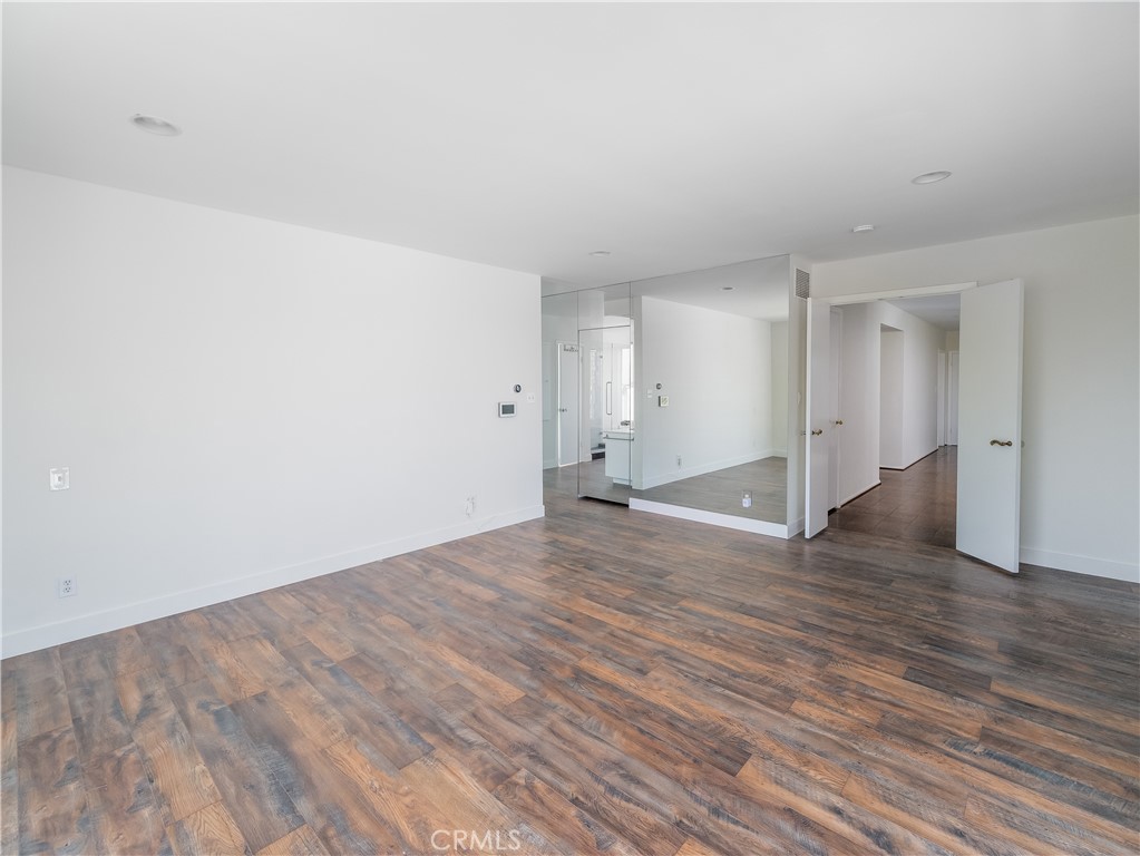 20193 Adele Drive Woodland Hills, CA 91364 - Photo 21 of 38 a view of an empty room with wooden floor