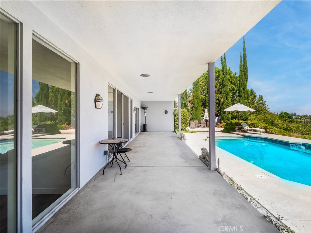 20193 Adele Drive Woodland Hills, CA 91364 - Photo 26 of 38 a view of a patio with a table and chairs