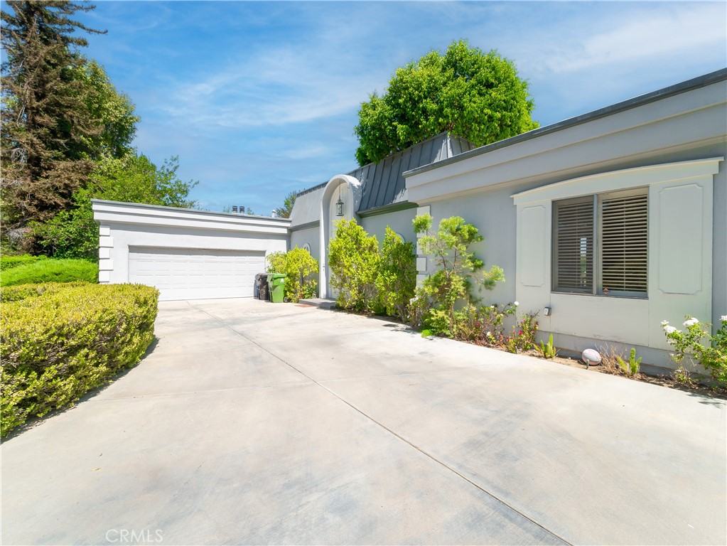 20193 Adele Drive Woodland Hills, CA 91364 - Photo 36 of 38 a front view of a house with garden