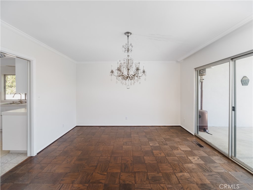20193 Adele Drive Woodland Hills, CA 91364 - Photo 6 of 38 a view of a chandelier in an empty room